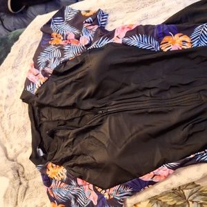 One piece with zip top and boy short style bottom half